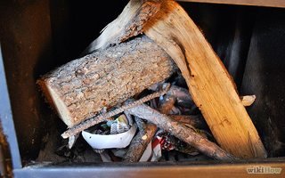 Paper firelighters amongst wood